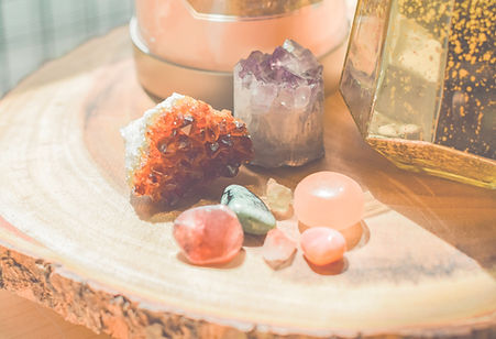 Image of different crystals on a wooden shelf