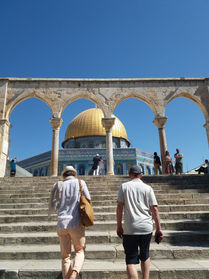 Visitors walking near the Dome of the Rock on the Temple Mount in Jerusalem
