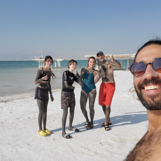 Guided group tour at the Dead Sea shoreline, enjoying the floating experience during a visit to the Dead Sea and Masada area.