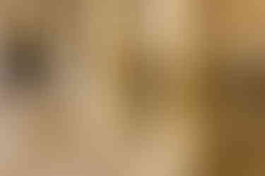 Tourists having fun peeking out from behind the massive ancient Roman columns of the Cardo in the Jewish Quarter.