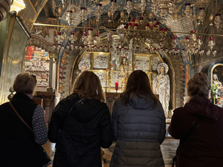 Visitors inside a richly decorated Jerusalem church during a Christian pilgrimage tour