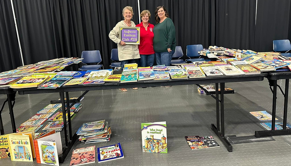 Volunteers serve at the book booth at last years event