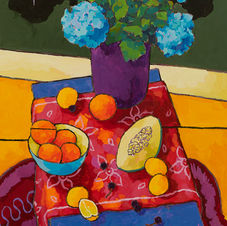 blue hydrangea with Oranges over red cloth