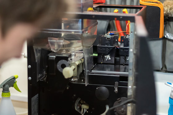 Engineer fixing coffee machine