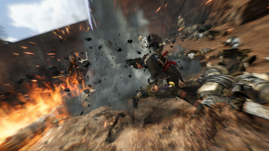 A man swings a large sword down into the ground, creating a massive blast of sand and dust as he crushes a group of enemies.