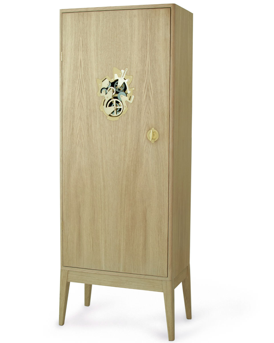 Minimalist oak cabinet by Stoft Studio featuring an exposed brass gear mechanism, merging Scandinavian design elegance with mechanical artistry and precision craftsmanship.