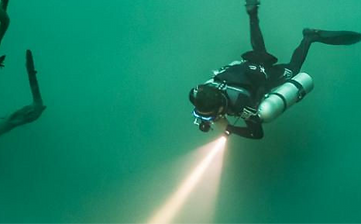 Weekly plan board showing reef, cenote cavern day, and Cozumel wall arranged for balance.