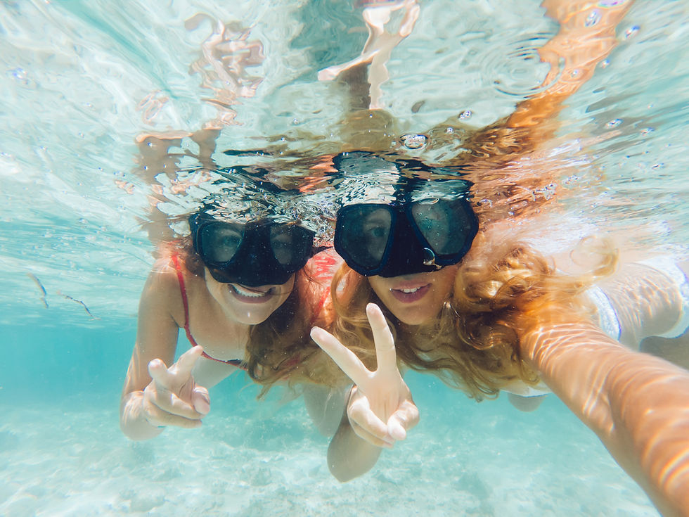 Snorkelers on the boat getting ready with masks and fins on a Cancun MUSA trip