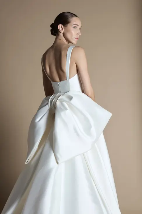 Halfpenny Dahlia bow wedding dress. Glowy, natural wedding makeup and sleek bun by Oonah bridal makeup.