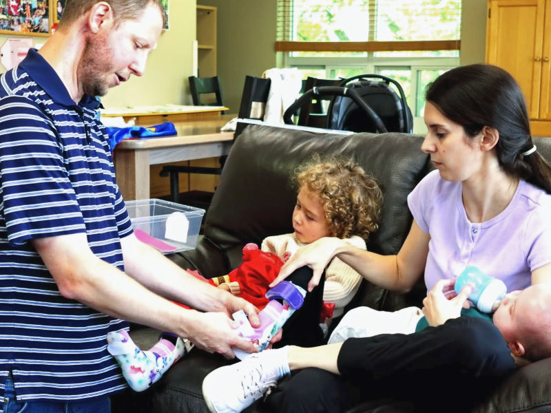 Four-year-old Lansdowne Heroes Walk and Roll ambassador Isla Clarke, pictured with her family, wears ankle-foot orthotics (AFOs) to help improve her strength and stability while standing.