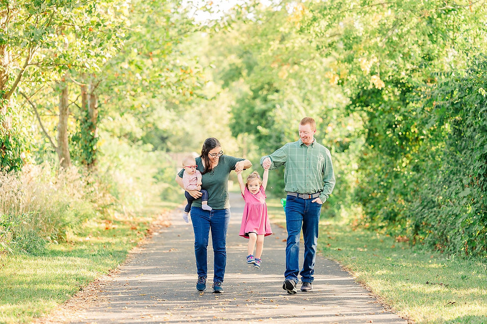Sweet summer family session at Lake Chaminwood in Channahon, IL filled with laughter, color, and heartwarming candid moments.