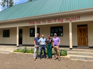 Pradeep Kapadia with a KEF alumni, Neema, and two donors.