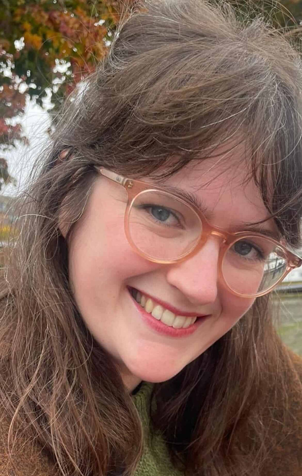 Students with teachers holding awards