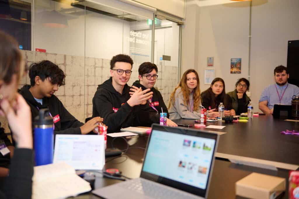 Dynamic discussion among members of the Speakers for Schools Youth Council, showcasing their passion for positive change.