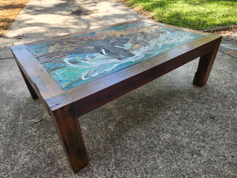 Stone and wood table featuring elephants