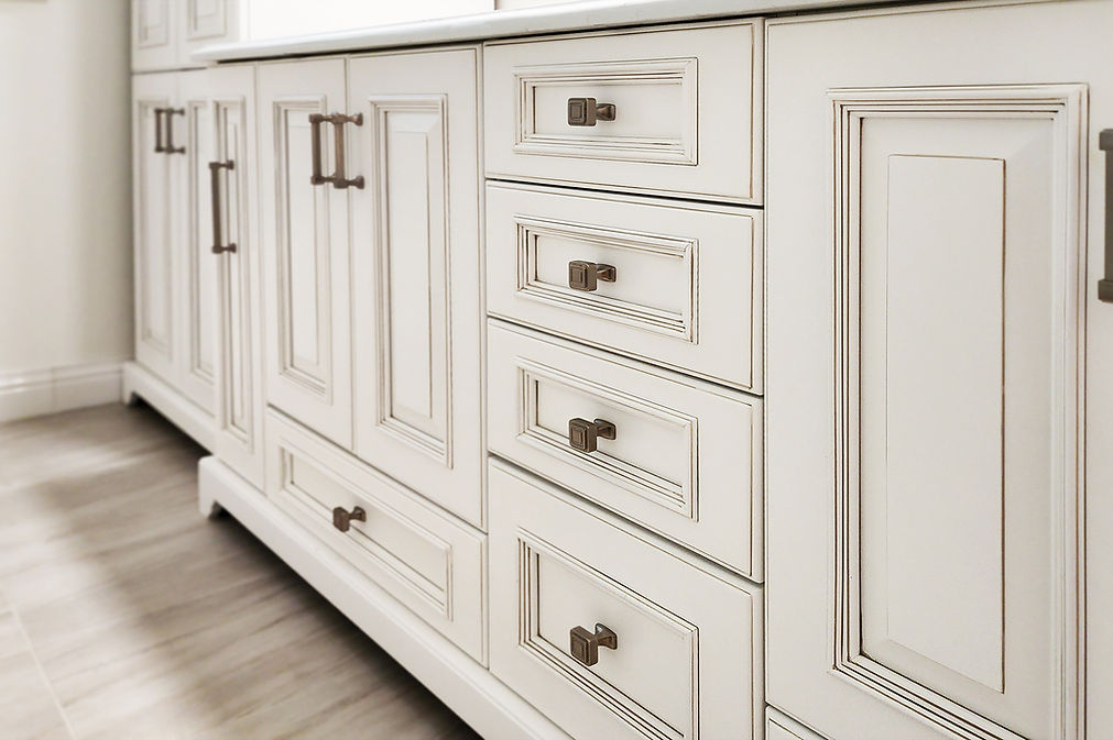 White kitchen with blue-green hexagonal backsplash tile