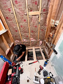 KCK Construction crew rebuilding subfloor framing during an insurance restoration project