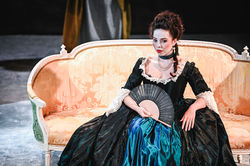 Lady Ashbrook sat on an ornate chair