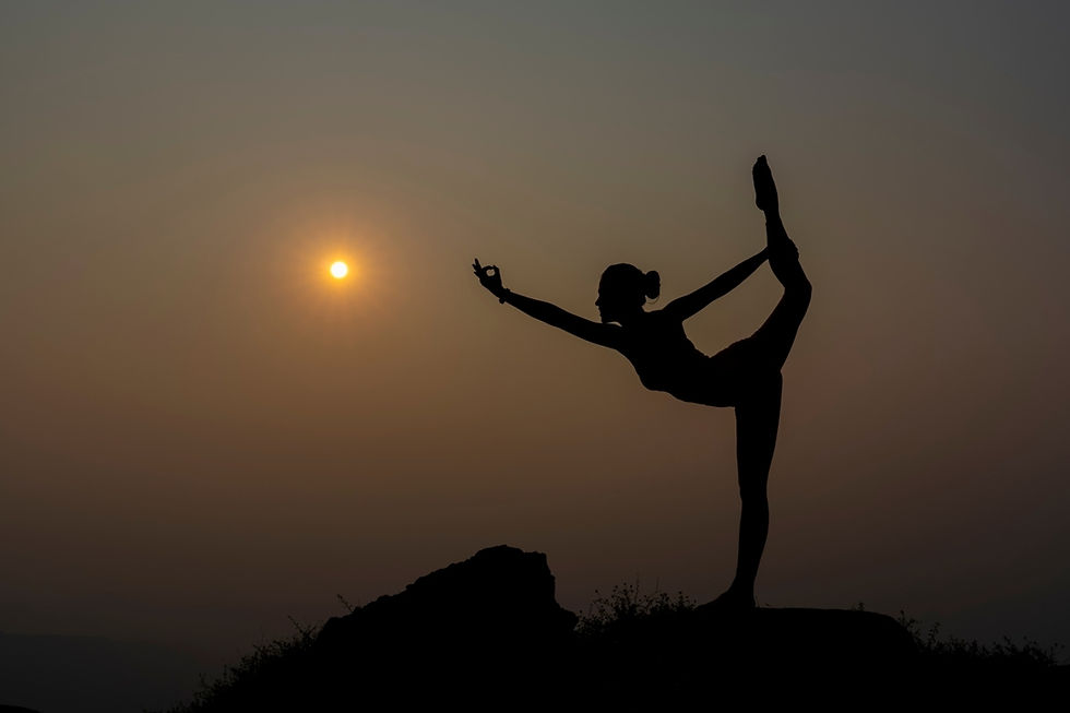 a woman balancing in a yoga pose