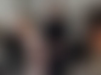 a women helping another women perform an athletic exercise