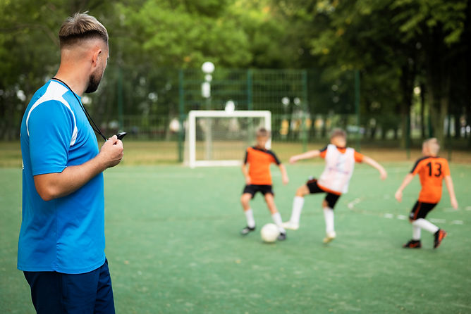 football-trainer-teaching-his-pupils.jpg