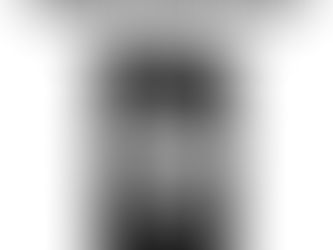 A floating head with bulging eyes and sharp teeth, engulfed in flame.