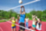 Kids playing volleyball.