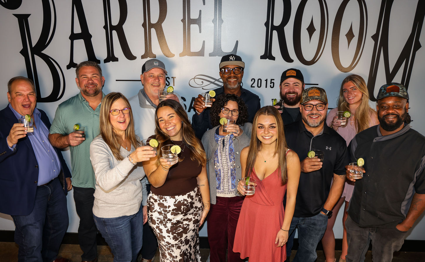 People toasting at The Barrel Room