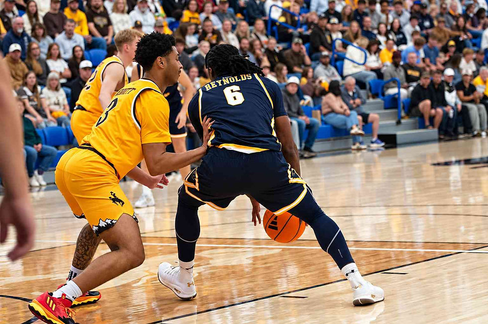 Wyoming guard Khaden Bennett (#3) defends Northern Colorado's Reynolds (#6) during an exhibition game in Gillette, Wyoming. Photo by Jeff Bugher, PokesNews.com.