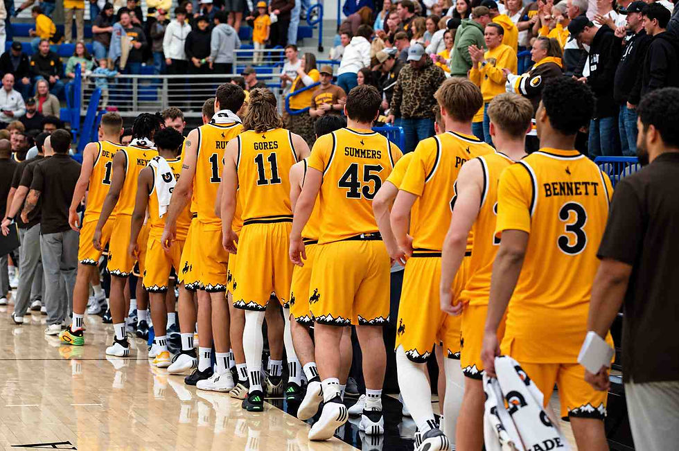 Wyoming men's basketball players walk off the court following an exhibition game against Northern Colorado in Gillette, Wyoming. Photo by Jeff Bugher, PokesNews.com.