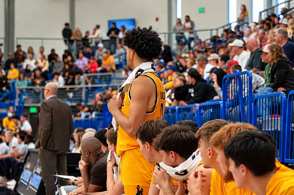 Wyoming guard Uriyah Rojas (#0) stands near the Cowboys' bench during an exhibition game against Northern Colorado in Gillette, Wyoming. Photo by Jeff Bugher, PokesNews.com.