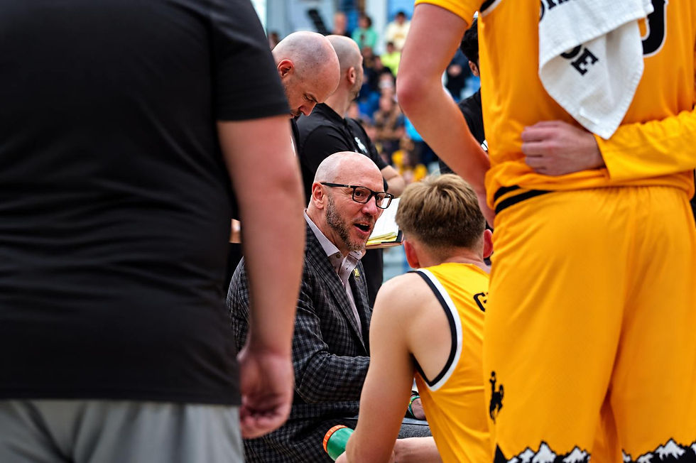Wyoming head men's basketball coach Sundance Wicks talks with his team during a timeout against Northern Colorado in an exhibition game in Gillette, Wyoming. Photo by Jeff Bugher, PokesNews.com.