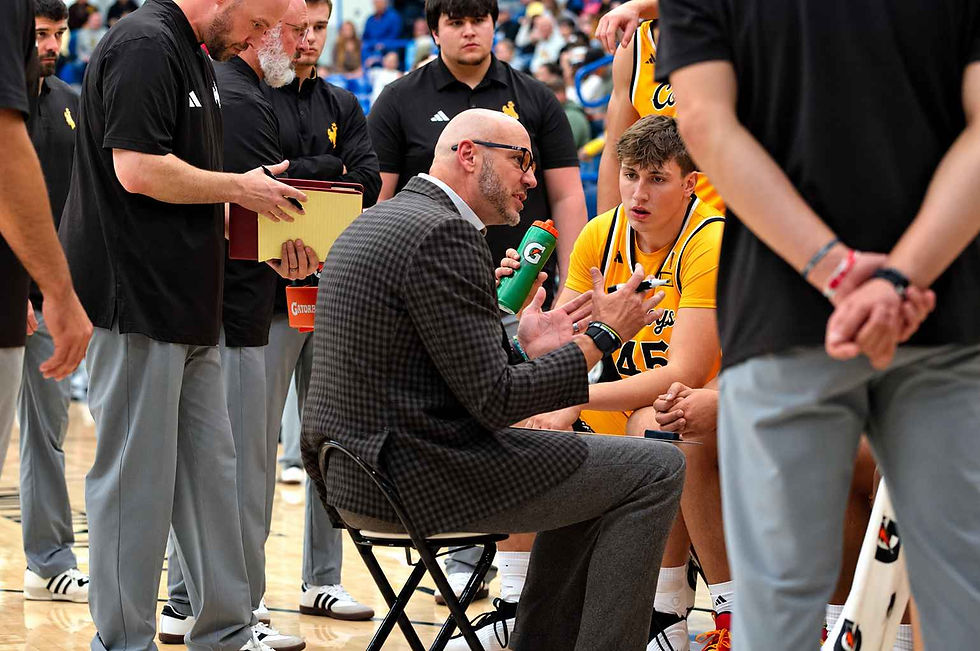 Wyoming head men's basketball coach Sundance Wicks talks with his team during a timeout against Northern Colorado in an exhibition game in Gillette, Wyoming. Photo by Jeff Bugher, PokesNews.com.