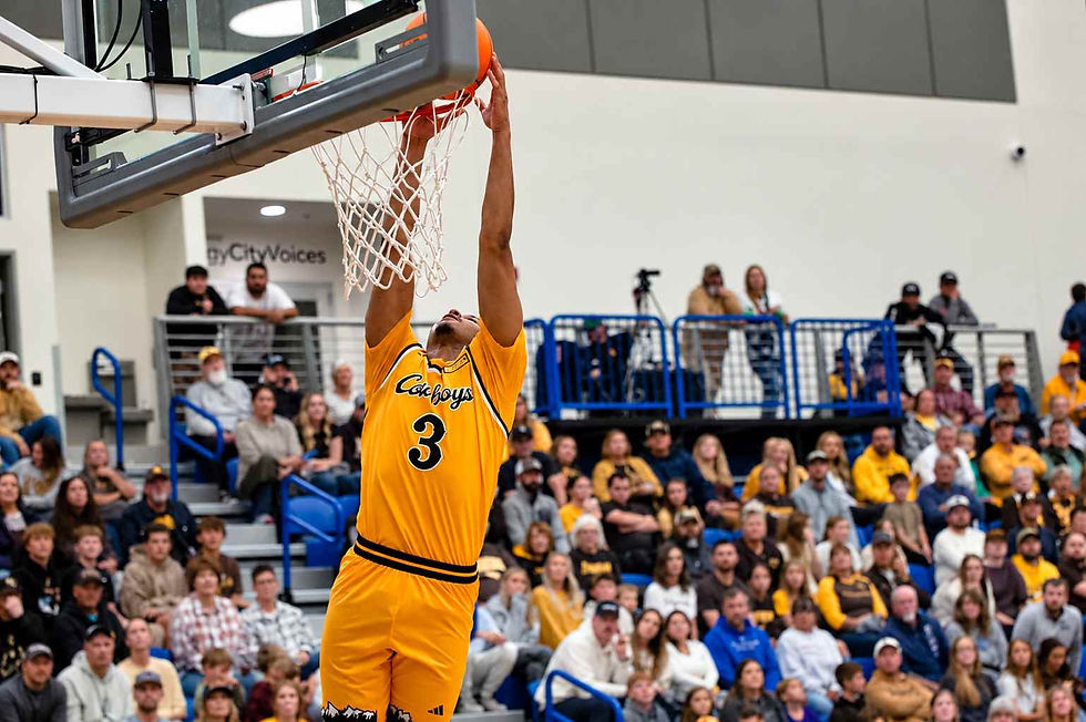 Wyoming guard Khaden Bennett (#3) goes up for a dunk during an exhibition game against Northern Colorado in Gillette, Wyoming. Photo by Jeff Bugher, PokesNews.com.
