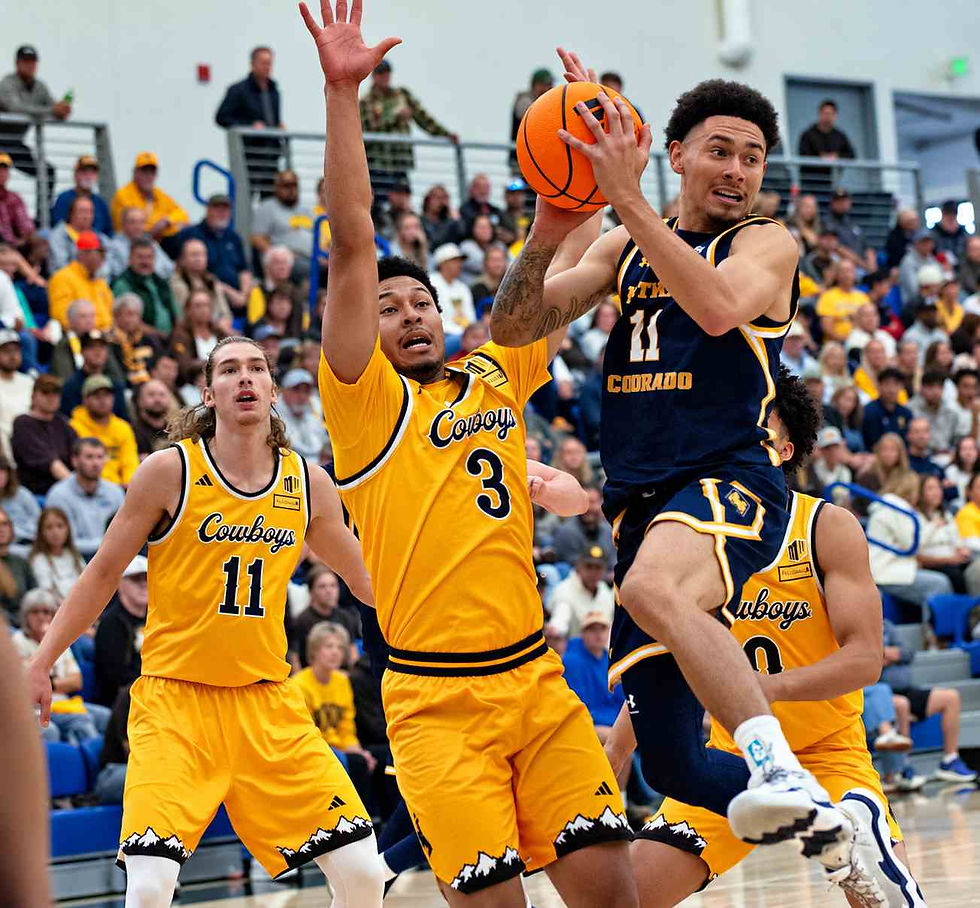 Wyoming guard Khaden Bennett (#3) defends Northern Colorado's (#11) as he drives toward the basket during an exhibition game in Gillette, Wyoming. Photo by Jeff Bugher, PokesNews.com.