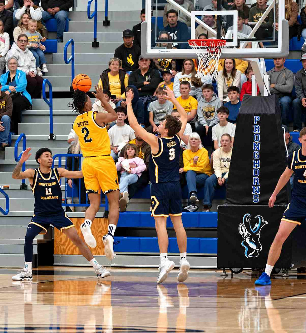 Wyoming guard Nasir "Naz" Meyer (#2) attempts a shot over a Northern Colorado defender during an exhibition game in Gillette, Wyoming. Photo by Jeff Bugher, PokesNews.com.
