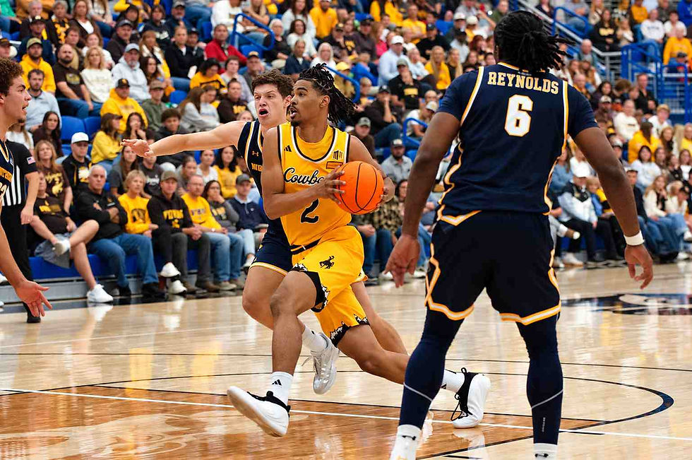 Wyoming guard Nasir "Naz" Meyer (#2) drives toward the basket while being defended by Northern Colorado players during an exhibition game in Gillette, Wyoming. Photo by Jeff Bugher, PokesNews.com.
