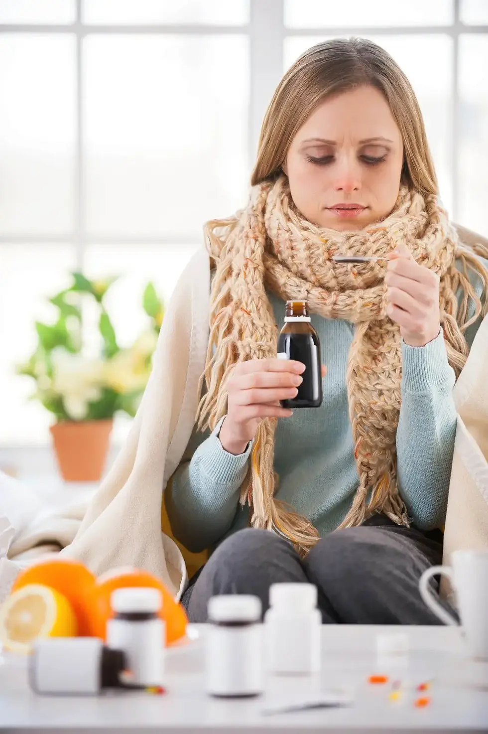 young-woman-taking-medicines-while-sitting-bed-her-apartment-influenza