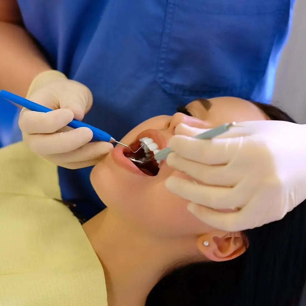 dentist-hands-working-young-woman-patient-with-dental-tools