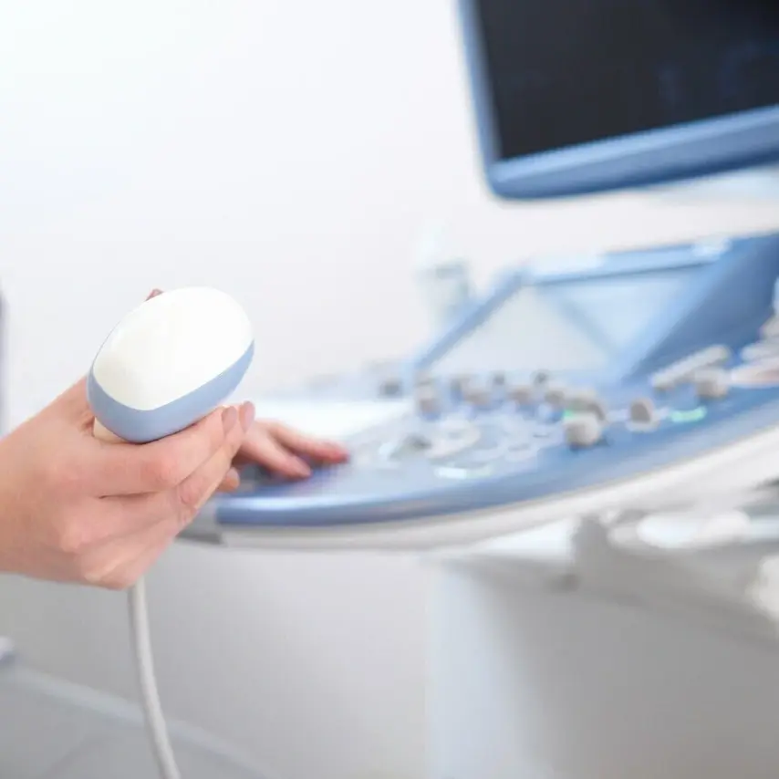 Female doctor using an ultrasound device