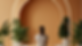 Person relaxing in a minimalist wellness studio with soft ambient lighting and organic textures