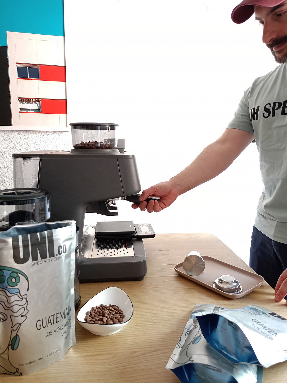 Alan Petasecca Donati locking the portafilter into the AEG 8000 Series espresso machine.