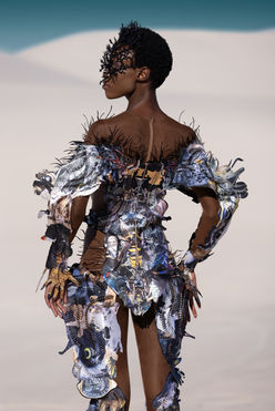 Chelsea Jean Lamm & Ashley Elizabeth Lamm – The Future of Sustainable Avant-Garde Couture
Discover the visionary world of Chelsea Jean Lamm & Ashley Elizabeth Lamm, a high-end couture duo with South African and German roots, redefining wearable art and sustainable luxury fashion. Their avant-garde creations fuse heritage craftsmanship, innovative textile techniques, and cutting-edge materials, making them a rising force in the future of fashion.
Each garment is a masterpiece of sustainability and artistry, featuring reclaimed print media, dead-stock silk, intricate hand embroidery, and experimental fabric manipulation. Chelsea’s couture designs embrace bold silhouettes and sculptural forms, while Ashley’s analogue collage techniques transform discarded materials into layered, textural storytelling.
Their work represents a new era of luxury fashion, where sustainability, innovation, and avant-garde design merge seamlessly. From laser-cut detailing to eco-conscious embellishments, every piece reflects a commitment to modern craftsmanship and ethical production.
For those seeking trendy, high-end, and concept-driven couture, their collections are the epitome of sustainable luxury. Explore their wearable art, statement couture, and fashion-forward designs—crafted for individuals who embrace artistic expression and the evolution of high fashion.
Echoes of Eden 2023 by Chelsea Jean Lamm in collaboration with Ashley Elizabeth Lamm, Look Alligator, modeled by Nondi Beattie from Boss Models, photographed by Nina Zimolong, Mask by Carina Shoshtary, shot in Cape Town, South Africa