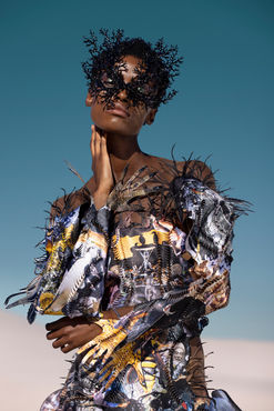 Echoes of Eden Summer 2023: Introducing „Echoes of Eden“, the latest collection from Chelsea Jean Lamm in collaboration with collage artist Ashley Elizabeth Lamm and mask artist Carina Shoshtary.     Drawing inspiration from the deep sea and its mystical inhabitants, this collection transports you to an otherworldly realm where utopian creatures reign supreme and the boundaries between human, animal, and machine are blurred. Each garment tells a powerful story, making the wearer feel invincible and warrior-like.  ​  “Echoes of Eden“ embraces the vision of a future where humanity and technology coexist in harmony with nature. With pieces that feature striking cyborg elements and nods to artificial intelligence, this collection challenges us to consider what it means to be human and to embrace the limitless potential of our interconnected world. Unique fashion creations by Chelsea Jean Lamm, a visionary emerging fashion designer with South African roots, now based in Munich. Experience the fusion of contemporary fine art and innovative fashion design as Chelsea brings to life wearable art collections inspired by her sister, Ashley Elizabeth Lamm's captivating paper collages. These sculptural garments are based on paper collages crafted from recycled images found in discarded books and magazines, creating a truly one-of-a-kind fashion statement. 

Shot by Nina Zimolong. Alligator Look by Chelsea Jean Lamm

Collage artist Ashley Elizabeth Lamm, photography by Nina Zimolong, model Nondi Beattie from Boss Models, mask artist Carina Shoshtary, make up Chelsey Abrahamse