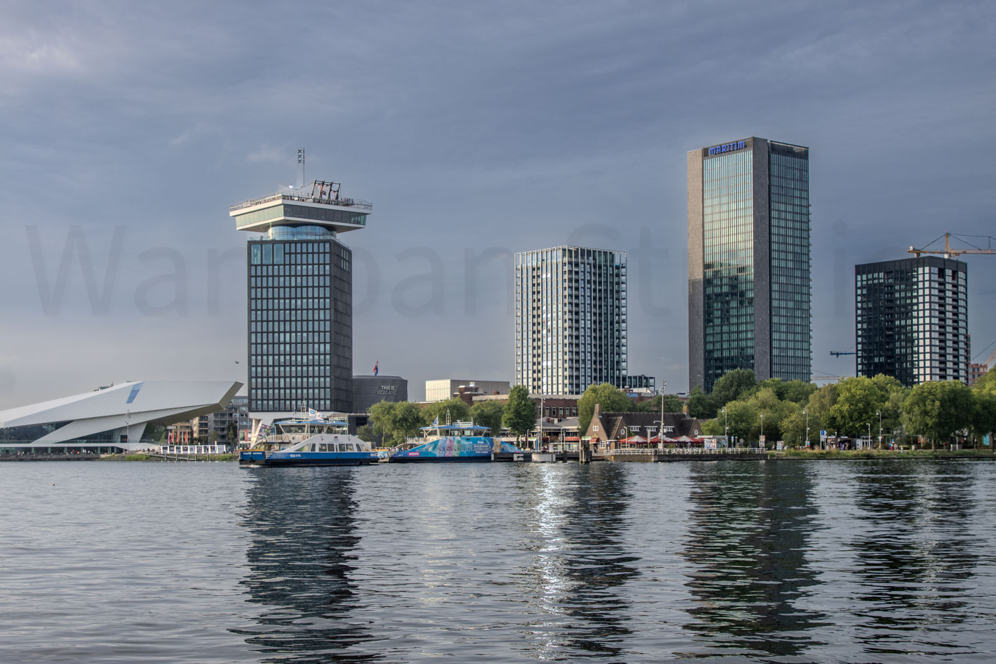 Adam and Towers on the IJ River Amsterdam