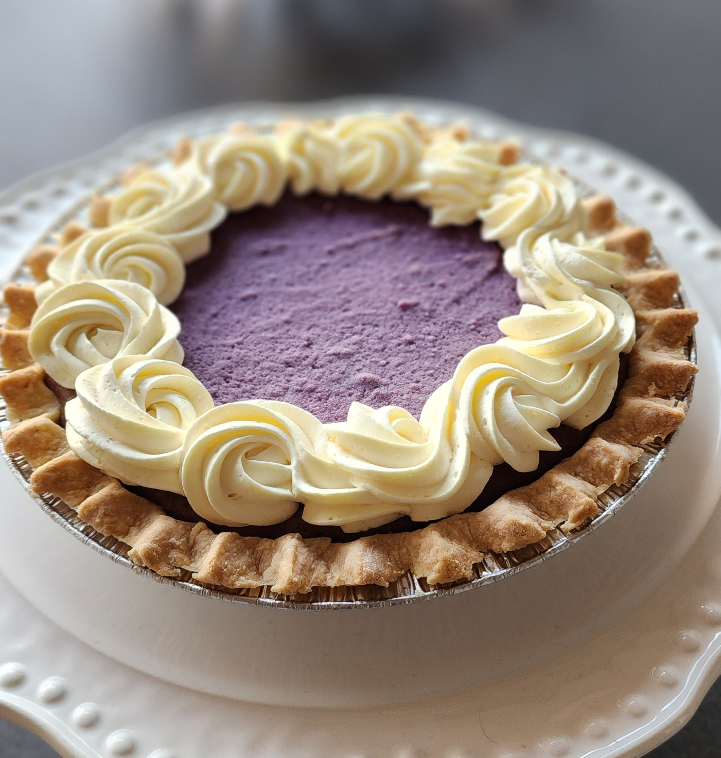 A fresh strawberry cream pie slice with bright red berries.