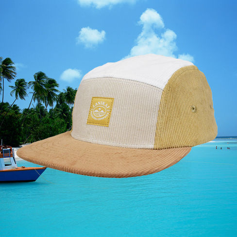 Corduroy vintage hat with tan, white, and brown panels. Square small woven label on crown.