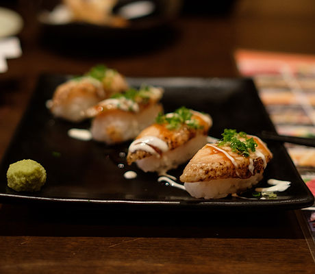 close-up-sushi-served-wooden-table.jpg