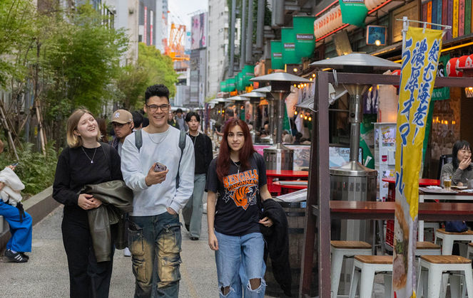 A tour leader and some tourist having fun in Tokyo