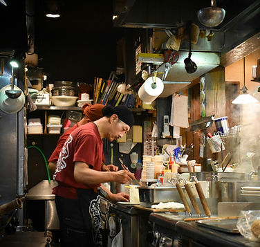 A Japanese chef cooking food in Tokyo